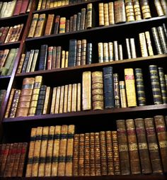 an old book shelf filled with lots of books