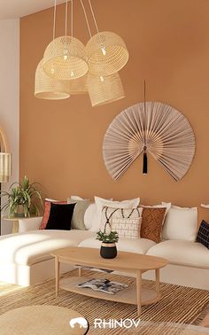 a living room filled with lots of furniture next to a wall mounted fan and chandelier