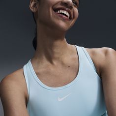 You're on the move. Your padding shouldn't be. This Swoosh bra's sewn-in pads stay in place so you can work hard without worrying about them shifting or folding. Great for training workouts and dance classes, medium support gives you a snug hold that helps keep everything in place. Plus, sweat-wicking, adaptive material quickly recovers its shape so you can stay comfortable throughout your workout. Nike Bra, High Support Bra, Bra Sewing, Training Workouts, Dance Classes, Padded Sports Bra, Nike Sports Bra, Women Lifestyle, Nike Swoosh