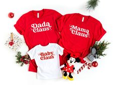 "Mama Claus Dada Claus Baby Claus Shirt, Christmas Family Matching T-Shirts, Christmas Couple Shirt, Santa Claus Shirt, Xmas Holiday Tees Thank you for shopping with us❤️ Size - Our products are unisex fit - You can check our size and color charts on our listing photos. How To Order - Select a size - Select a t-shirt color - If available, indicate the design (text) color in the personalization box - Click add to cart. You can go back to add more shirts. - Click \"Proceed to check out\". Care Instruction -Machine wash in cold water -Do not use bleach -Tumble dry low -Inside out, wash with delicate cycle -Do not iron directly over design Production and Shipping - Processing is 1-3 days * Shipping Time is depending on the shipping option that you choose during to checkout process - Please con Funny Sibling Shirts, Matching T Shirts, Christmas Party Shirts, Xmas Tees, Sibling Shirts, Womens Christmas Shirts, Funny Christmas Sweaters, Couple Shirt, Funny Family