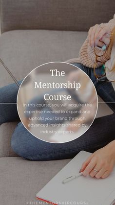 a woman sitting on a couch with a notebook and pen in her hand, reading the mentorship course