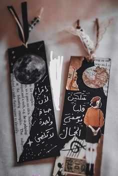 two bookmarks with arabic writing on them