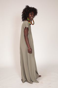 "This oversize almond green maxi dress is a great addition to your wardrobe. It has a very loose fit, short sleeves, a deep v-neck and best of all - pockets! The dress is made out of top quality modal lycra and can be suitable for both the day or a night out on the town. Suitable for summer and winter. Fits many body figures. OBI BELT CAN BE PURCHASED SEPARATELY Fabric: Modal Lycra ONE SIZE: Bust- 96cm / 37.7 \" Hips - 134cm / 52.7\" Sleeve - 24cm/ 9.4\" This dress is available in two different Oversized Maxi Dress For Daywear, Beige Relaxed Fit Maxi Dress, Green Long Maxi Dress For Daywear, Green Relaxed Fit Maxi Dress With V-neck, Oversized Green V-neck Maxi Dress, Oversized Long Green Dress, Green Bohemian Maxi Dress For Daywear, Flowy Green Maxi Dress For Daywear, Green Maxi Dress For Daywear