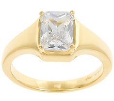 a yellow gold ring with a princess cut diamond