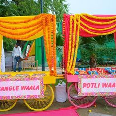 an elaborately decorated cart with orange and pink decorations