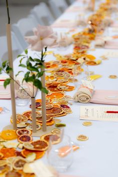 the table is covered with orange slices and flowers