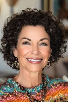 Layered Curly Crop Hairstyle on a smiling woman in her 50s with brown hair. Post Chemo Hairstyles Curly Short Hair, Curly Hair Long Face, Short Thick Curly Hairstyles, Curly Hairstyles Over 50 Women, Shaggy Short Curly Hair, Chin Length Curly Hair With Layers, Curly Hairstyles For Women Over 50, Layered Curly Bob Hairstyles, Curly Hair Styles For Short Hair