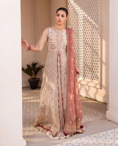 Brand: XENIA FormalsProduct Code: XFU-23-457 SHERMINACollection: Luxury Unstitched Formals CollectionFabric: Net DESIGN DETAILS: Embroidered Net Front 60 Inches Embroidered Net Back 60 Inches Embroidered Net Sleeves Seleeves Patch 3 Front & Back Yoke 24 Inches Embroidered Organza Dupatta 2.75 Yds Dupatta Patch 1 Raw Silk Trousers 2.5 Yds DISCLAIMER:* Lining, Laces, and Tassels are not included in unstitched variants.* Embellishment items in stitched outfits are subject to market availability.* T Organza Gowns, Pakistani Style, Bridal Jacket, Silk Trousers, Net Dupatta, Pakistani Designers, Silk Dupatta, Pakistani Bridal, 3 Piece Suits