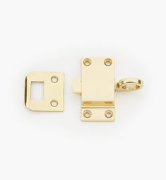 an image of a pair of gold door latches on a white background with clippings