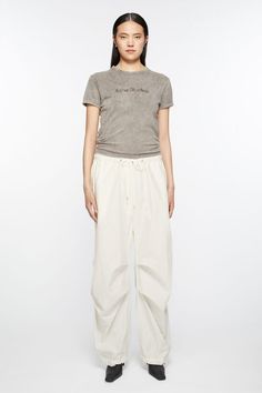 Relaxed Cotton Parachute Pants For Loungewear, Cotton Relaxed Fit Pants With Drawstring, Relaxed Fit Cotton Bottoms With Gathered Waist, Cotton Parachute Pants With Functional Drawstring For Streetwear, Casual Cotton Pants With Gathered Waist, Cotton Parachute Pants With Drawstring For Streetwear, Cotton Bottoms With Relaxed Fit And Gathered Waist, Relaxed Fit Parachute Pants With Drawstring, Relaxed Fit Cotton Cargo Pants With Functional Drawstring