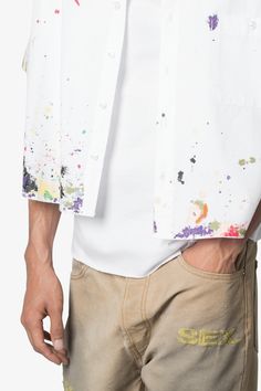 the Poplin Painter S/S Shirt is made from a lightweight cotton fabric. The relaxed-fit shirt features a button placket, paint details throughout, and is finished with a pocket on the chest. details relaxed, cropped fit 100% cotton model is 6’0, 140 lbs and wears a size medium White Short Sleeve Shirt With Pockets For Spring, Relaxed Fit Cotton Top With Paint Splatter, Casual Paint Splatter Tops For Summer, Summer Relaxed Fit Paint Splatter Tops, Spring Short Sleeve Tops With Paint Splatter, Spring Paint Splatter Short Sleeve Tops, Casual Paint Splatter Top For Spring, Casual Spring Tops With Paint Splatter, Summer Short Sleeve Top With Paint Splatter