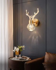 a living room with a chair and lamp on the wall