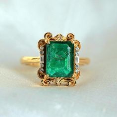 Emerald Ring Vintage, Real Emerald Ring & Diamond For Women, 14k Emerald Solitaire Wedding Ring, 3Ct Octagon Emerald Cut Stacking Ring Gift This ring features a stunning 3 Carat Natural Dark Emerald from Zambia framed by two baguette diamond moissanite and round diamond moissanite. This ring looks more beautiful in real with all vintage vibe. Available in 14K solid yellow gold & 18k Gold plated over silver. This ring acts as a perfect birthstone stacking ring, or a beautiful  & unique gift for w Luxury Emerald Rings With Diamond Cut, Luxury Emerald Rings With Accent Stones, Luxury Diamond Ring With Emerald Accent Stones, 14k Gold Emerald Cut Emerald Ring For Wedding, Luxury Octagon Diamond Ring With Accent Stones, Emerald Cut Ring With Prong Setting For Wedding, Emerald Cut Wedding Rings Fine Jewelry, Formal Octagon Emerald Diamond Ring, Emerald Cut Wedding Ring With Prong Setting