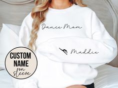 "Welcome to MDTrends!   Introducing our 'Dance Mom' Crewneck Sweatshirt, the perfect way to cheer for your favorite dancer. This cozy and customizable sweatshirt is designed just for you, with a special touch. Personalize it with your dancers names printed on the sleeve, creating a unique and cherished keepsake. Whether you're treating yourself or searching for a heartwarming gift, this sweatshirt is the ideal choice. Wear it with pride, showing the world that you're a proud mama who cheers for Aunt Niece, Mom Crewneck, Custom Softball, Lacrosse Mom, Sport Mom, Wrestling Mom, Dance Mom, Custom Football, Softball Mom