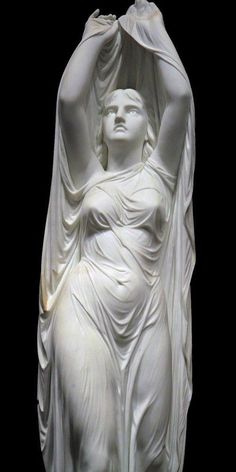 a white statue with a woman's head resting on her arm and hands behind her back