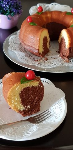 two pieces of cake on plates with one slice missing