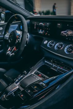 the interior of a car with dashboard and steering wheel