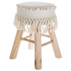 a stool with tassels on the legs