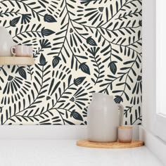 the wallpaper is decorated with black and white leaves