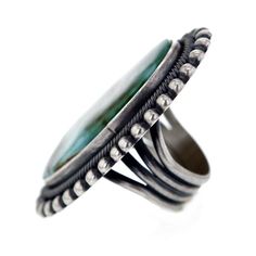 this absolutely stunning Navajo ring is a bold conversation piece handcrafted by the prominent Navajo artist E R B this ring spellbinds with its size as well as its beauty executed in the classic Navajo style the ring features a gorgeous and sizeable center piece of Royston turquoise stone measuring approximately 7/8" x 1 5/8" inlaid in sterling silver bezel this ring is a true showpiece handmade & stamped by E R B bezel and band handmade from .925 Sterling Silver size 9 approximate centerpi Navajo Ring, Navajo Style, Handmade Stamps, Navajo Rings, Royston Turquoise, Silver Lake, Turquoise Stone, Conversation Piece, Sterling Silver Ring