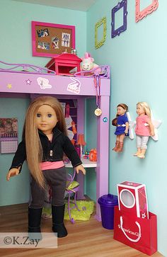 the doll is standing in front of her bunk bed