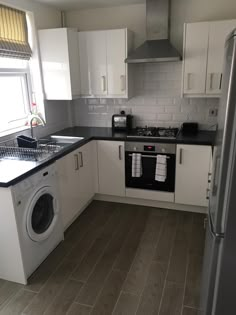 the kitchen is clean and ready to be used as a washer and dryer