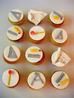 cupcakes with different types of school supplies on top of each one, including rulers and pencils