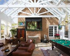 a pool table in the middle of a living room