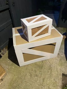 two boxes are stacked on top of each other