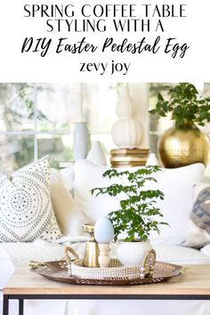 a coffee table with some plants on it and the words spring coffee table styling with diy easter pastel egg