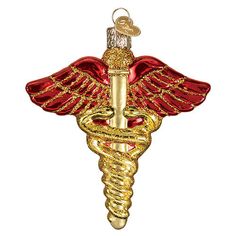 a gold and red medical ornament with a snake wrapped around it's head