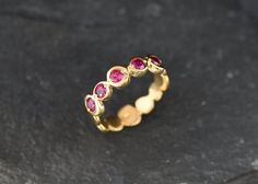 Gold Ruby Ring set with a Created Ruby in a perfect diamond cut & bright red color with perfect clarity, at 3mm diameter each, 1 Carat combined.Gold Bubble Band made of Gold Vermeil ☞ thickest 18k Gold Plating on top of Solid 925 Sterling Silver ☞ made to last.☞ Choose your size ☞ I resize (before shipping) for FREE to Any size*Matching Pendant & Matching Earrings - please ask me⌛Last Ring left ⌛Details : ♥ Each item comes in a cute GIFT BOX ✓ ♥ GUARANTEE on the materials ✓♥ Created Ruby Red Stackable Fine Jewelry, Red Ruby Jewelry With Bezel Setting, Red Ruby Ring With Bezel Setting, Stackable Red Ruby Ring, Red Bezel Set Ring Jewelry, Red Bezel Setting Ring, Red Bezel Set Ring, Ruby Ring Set, Gold Ruby Ring