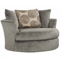 a gray chair with a pillow on top of it