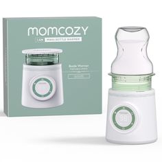 the baby bottle warmer is next to its box