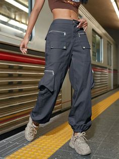 Experience rugged style and practicality with our Street Flap Pocket Cargo Pants. Designed for casual wear, these plain-patterned pants feature a zipper fly and a natural waistline for a comfortable fit. With a regular fit and long length, they offer freedom of movement while maintaining a trendy look. The non-stretch fabric ensures durability, making them perfect for any adventure. Details: Style: Casual Pattern Type: Plain Type: Cargo Pants Closure Type: Zipper Fly Waist Line: Natural Length: Urban Wide Leg Bottoms With Zipper Closure, Baggy Straight Leg Bottoms With Zipper Closure, Baggy Straight-leg Bottoms With Zipper Closure, Casual Wide-leg Pants With Zipper Closure, Baggy Cotton Bottoms With Zipper Closure, Streetwear Pants With Zipper Closure, Casual Trousers With Zipper Closure, Casual High Waist Pants With Zipper Closure, Full Length Pants With Zipper For Streetwear