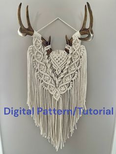 a white wall hanging with antlers on it's side and the words digital pattern / tutorial written below