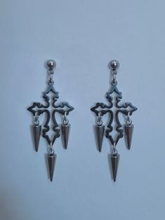 Cross earrings with spikes made out of stainless steel!  If you have any questions please contact me via Etsy messages!  Thank you Edgy Metal Pierced Plug Earrings, Punk Surgical Steel Pierced Earrings, Edgy Silver Stainless Steel Earrings, Punk Metal Earrings With Spikes, Punk Metal Spiked Earrings, Edgy Stainless Steel Pierced Earrings, Edgy Surgical Steel Earrings, Edgy Metal Earrings With Spikes, Edgy Metal Spike Earrings