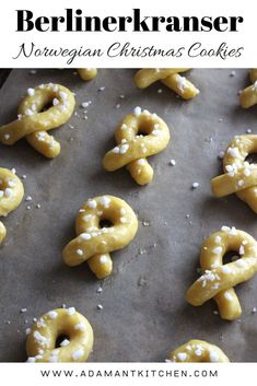 there are many pretzels on the baking sheet with white sprinkles