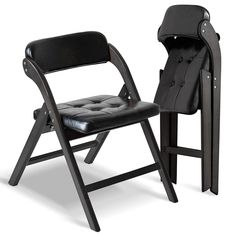 a black folding chair next to a wooden stand with a coat on it's back