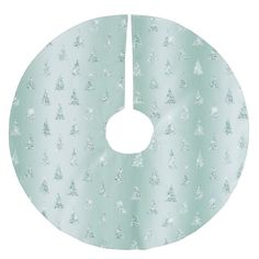 a green and white christmas tree skirt with silver trees on the bottom, in front of a light blue background