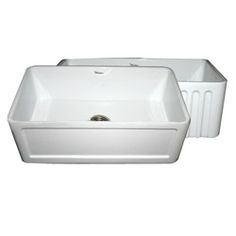 a white sink sitting on top of a counter