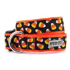 an orange and black dog collar with candy corn on it