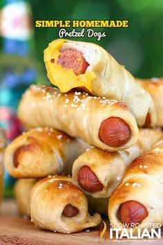 a pile of hot dogs with cheese on them