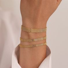 The Bismarck Chain Bracelet in 14k Gold is a chic tribute to timeless design. This opulent item, which is expertly fashioned from 14-karat gold, includes a 4mm mesh chain known for its subtle complexity and timeless appeal. The bracelet has a distinctive and retro appeal thanks to the Italian mesh chain design, which exudes classic charm. This bracelet perfectly balances history and contemporary elegance by fusing traditional Italian workmanship with the traditional Bismarck design. Due to its adaptability, it may be a priceless complement to any outfit, enhancing any appearance with its vintage charm and understated beauty. ◖ P R O P E R T I E S ◗ * Material: 14k Gold (100% real, not plated, not filled) * Handmade Jewelry * Weight (for 7"): Size #1: 1,7gr Size #2: 2,3gr Size #3: 3,1gr Ple Elegant Everyday Bracelets With Rolo Chain, Elegant Yellow Gold Rolo Chain Bracelet, Elegant Gold Bracelets With Rolo Chain, Elegant Gold Curb Chain Bracelet, Elegant Gold Curb Chain Bangle Bracelet, Modern Formal Bracelets With Rolo Chain, Elegant Rolo Chain Link Bracelets, 14k Yellow Gold Bracelets With Rolo Chain, Elegant Link Bracelets With Rolo Chain