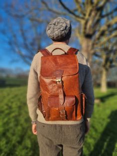 Large unisex leather travel backpack in dark brown. This handmade vintage leather backpack is unisex in design and would suit women and men. This rucksack has a minimalist and timeless design and is versatile to use. Whether you're looking for a practical travel rucksack, school backpack, spacious laptop bag or leather gym backpack, this vintage style backpack may be ideal. Get ready to explore the world with unrivalled style and functionality. This 16" leather rucksack makes the ideal travel co Large Capacity Brown Leather Backpack For Adventure, Brown Leather Adventure Backpack, Minimalist Laptop Bag, Brown Vintage Leather Backpack For Adventure, Rugged Leather-lined Backpack, Study Bag, Hippie Backpack, Brown Leather-backed Adventure Backpack, Perfect Travel Bag