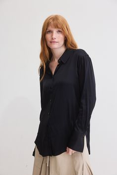 Turn heads in the Shift Your Gaze Silk Button Down, a romantic and luxurious addition to any look. The elegant silhouette provides a comfortable and relaxed fit, allowing you to move freely and gracefully. Chic Viscose Shirt With Button Closure, Chic Viscose Shirt, Viscose Blouse With Button Closure For Daywear, Elegant Black Shirt For Daywear, Elegant Black Viscose Blouse, Black Viscose Office Blouse, Elegant Black Blouse With Back Button Closure, Merlot Color, The Shift