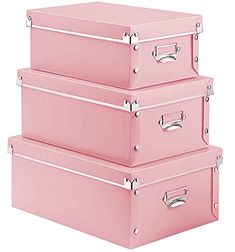 three pink suitcases stacked on top of each other