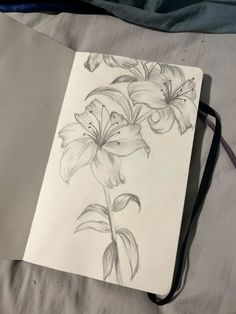 a pencil drawing of flowers on a sheet of paper