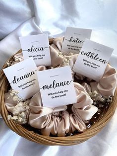 a basket filled with lots of different types of cloth wrapped in paper and tied to each other