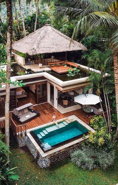 an aerial view of a house with a swimming pool